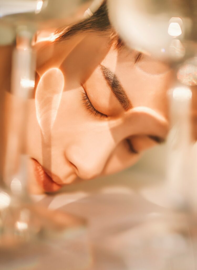 woman portrait with closed eyes through glass